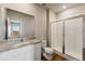 Bathroom with granite countertop, shower, and toilet at 7318 Arkansas St, Frederick, CO 80530