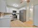 Galley kitchen with stainless steel appliances at 635 S Alton Way # 6A, Denver, CO 80247