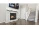 Gas fireplace with gray stone surround and mantel at 21953 E Quincy Cir, Aurora, CO 80015