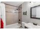 Updated bathroom with tub, shower, and modern vanity at 12030 Monaco Dr, Brighton, CO 80602