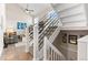 Modern staircase with metal railing at 12030 Monaco Dr, Brighton, CO 80602