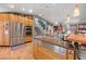 Modern kitchen with stainless steel appliances and hardwood floors at 5868 Routt St, Arvada, CO 80004