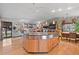 Large kitchen island with a cooktop and stainless steel appliances at 5868 Routt St, Arvada, CO 80004