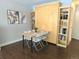 Small dining area with fold-away table and Murphy bed at 1196 N Grant St # 112, Denver, CO 80203