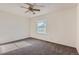 Spacious bedroom with ceiling fan and neutral carpeting at 1922 S Oswego Way, Aurora, CO 80014