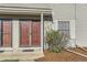 Townhome entrance with double doors and shrubbery at 1922 S Oswego Way, Aurora, CO 80014