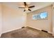 Bright bedroom with ceiling fan and carpet at 11191 E Harvard Dr, Aurora, CO 80014