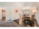 Dining area with dark hardwood floors and a glass-top dining table at 11191 E Harvard Dr, Aurora, CO 80014