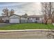 Front view of a charming ranch home with fresh landscaping at 5265 Chandler Way, Denver, CO 80239