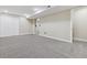 Spacious finished basement with neutral carpeting and ample storage at 8543 W Arizona Dr, Lakewood, CO 80232