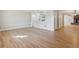 Light-filled living room featuring hardwood floors and a pass-through to the kitchen at 8543 W Arizona Dr, Lakewood, CO 80232