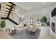 Bright living room with a modern fireplace and staircase at 671 Elati St, Denver, CO 80204