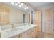Bathroom with double vanity and marble countertop at 22141 Chippewa Ln, Golden, CO 80401