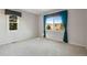 Bright bedroom with large windows offering scenic views at 22141 Chippewa Ln, Golden, CO 80401