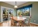 Dining area with wooded views and sliding glass doors at 22141 Chippewa Ln, Golden, CO 80401