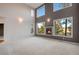 Living room with a fireplace and large windows at 22141 Chippewa Ln, Golden, CO 80401