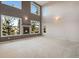Spacious living room with a fireplace and large windows offering scenic views at 22141 Chippewa Ln, Golden, CO 80401