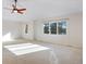 Large main bedroom with ceiling fan and access to en-suite bathroom at 22141 Chippewa Ln, Golden, CO 80401