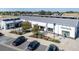 Aerial view of a modern town hall building with solar panels at 45044 Sunflower Ln, Bennett, CO 80102