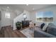 Bright living room with hardwood floors and modern furniture at 45044 Sunflower Ln, Bennett, CO 80102