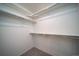 Large walk-in closet with ample shelving and hanging space at 45044 Sunflower Ln, Bennett, CO 80102