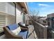 Private balcony with wicker chairs, offering a relaxing outdoor space at 221 S Garfield St # 208, Denver, CO 80209