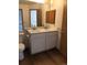 Bathroom with double vanity and updated fixtures at 10242 W Dartmouth Ave, Lakewood, CO 80227