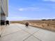 Large concrete patio with fire pit and views of open space at 16475 Essex S Rd, Platteville, CO 80651