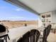 Spacious backyard patio with fire pit, grill, and seating area at 16475 Essex S Rd, Platteville, CO 80651