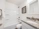 Simple bathroom with a tub/shower combo, toilet, and granite countertop at 16475 Essex S Rd, Platteville, CO 80651