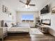 Main bedroom with fireplace and large window at 16475 Essex S Rd, Platteville, CO 80651
