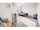 Bright bedroom with a single bed, built-in shelving, and a cheerful atmosphere at 16475 Essex S Rd, Platteville, CO 80651