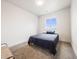 Comfortable bedroom with a double bed and a window offering natural light at 16475 Essex S Rd, Platteville, CO 80651