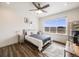 Main bedroom with large window and ceiling fan at 16475 Essex S Rd, Platteville, CO 80651
