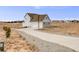 Two-story home with attached three-car garage and long driveway at 16475 Essex S Rd, Platteville, CO 80651