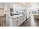 Modern kitchen with white cabinets and granite countertops at 16475 Essex S Rd, Platteville, CO 80651