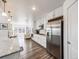 Modern kitchen with stainless steel appliances and granite countertops at 16475 Essex S Rd, Platteville, CO 80651
