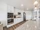 Open kitchen with stainless steel appliances and granite countertops at 16475 Essex S Rd, Platteville, CO 80651