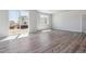 Spacious living area featuring vinyl plank flooring and large windows at 3462 N Highlands Creek Pkwy, Aurora, CO 80019