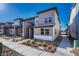 Modern two-story home exterior with a welcoming walkway and landscaping at 6541 N Dunkirk St, Denver, CO 80249