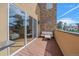 Private deck with seating area, sliding glass doors to interior at 756 Dreamcatcher Ln, Evergreen, CO 80439