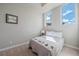 Cozy bedroom with a double bed and two windows with natural light at 756 Dreamcatcher Ln, Evergreen, CO 80439