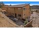 Backyard with fire pit and patio, mountain views at 756 Dreamcatcher Ln, Evergreen, CO 80439