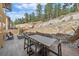 Spacious patio with dining table and chairs at 756 Dreamcatcher Ln, Evergreen, CO 80439