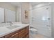 Clean bathroom with a bathtub, toilet, and modern vanity at 756 Dreamcatcher Ln, Evergreen, CO 80439