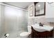 Basement bathroom with a walk-in shower and modern sink at 1654 S Perry St, Denver, CO 80219