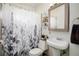 Clean bathroom featuring a shower/tub combo and updated vanity at 1654 S Perry St, Denver, CO 80219