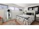 Bedroom with a full-size bed and a large mirror at 1654 S Perry St, Denver, CO 80219