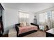 Bedroom with daybed and built-in closet at 1654 S Perry St, Denver, CO 80219