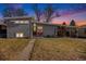 Gray ranch house with a landscaped yard and walkway at 1654 S Perry St, Denver, CO 80219